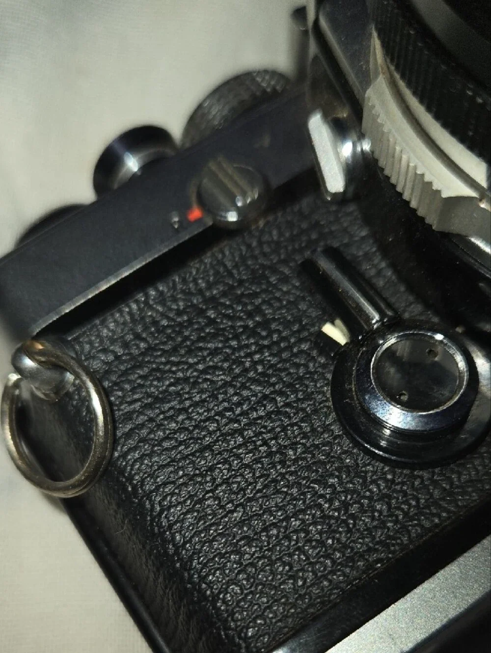 Olympus OM-1 Silver and Black Film SLR with Black Zoom Lens